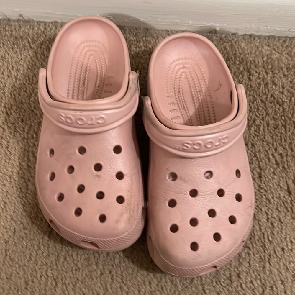 Used pink Crocs